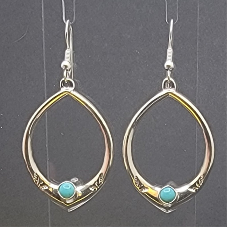 Stylish 925 Sterling Silver Teardrop Turquoise Hoop Earrings with a vibrant turquoise cabochon. These lightweight hoops are handcrafted and embody a boho chic aesthetic, making them perfect for casual jewelry or everyday wear. Enjoy the combination of turquoise hoop earrings and sterling silver for a trendy look.