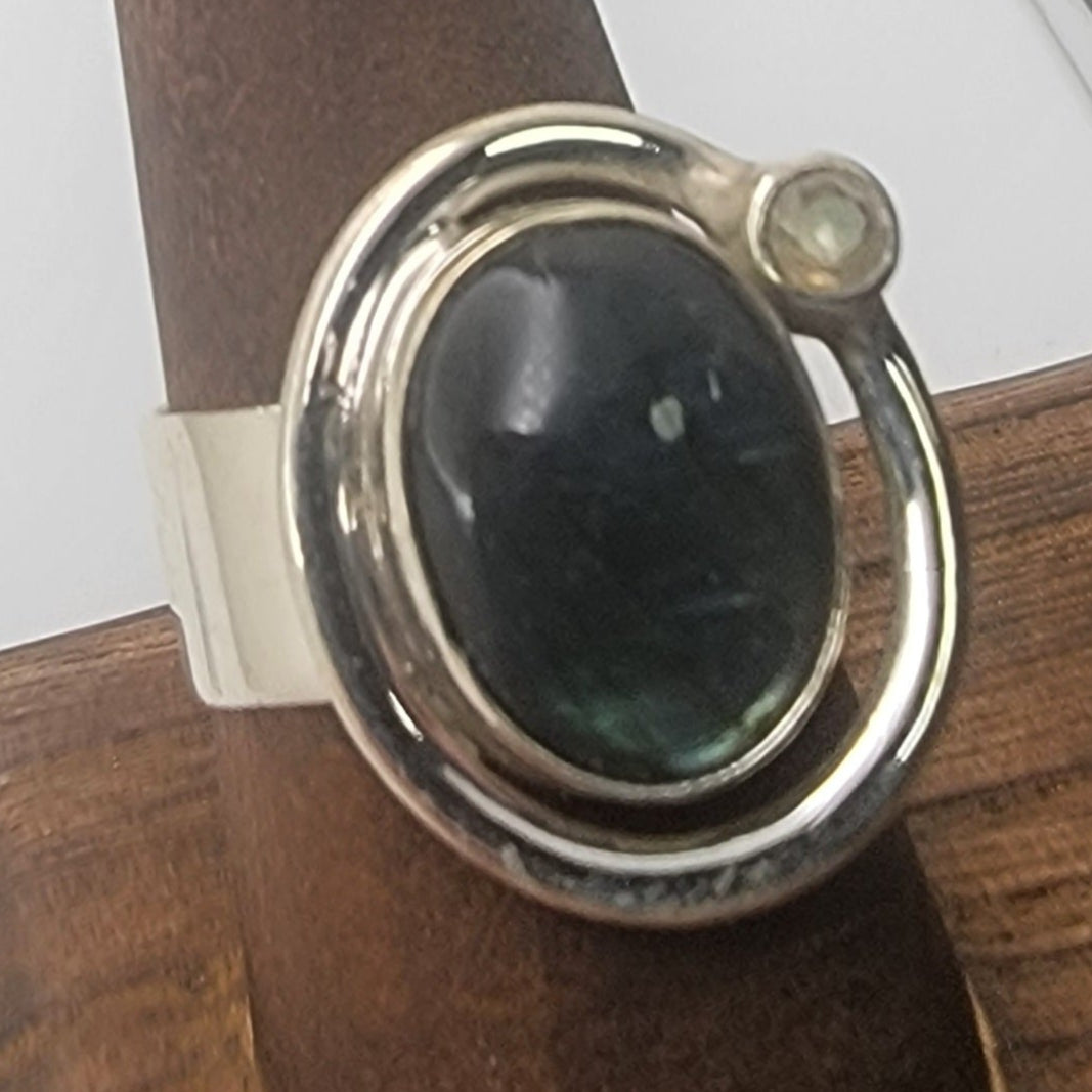 Labradorite Ring 925 Sterling Silver Statement Ring featuring a polished labradorite cabochon and clear quartz in an elegant design. Ideal casual jewelry and perfect as a Gift for Her or Gift for Him, this unique statement ring is crafted from durable sterling silver.