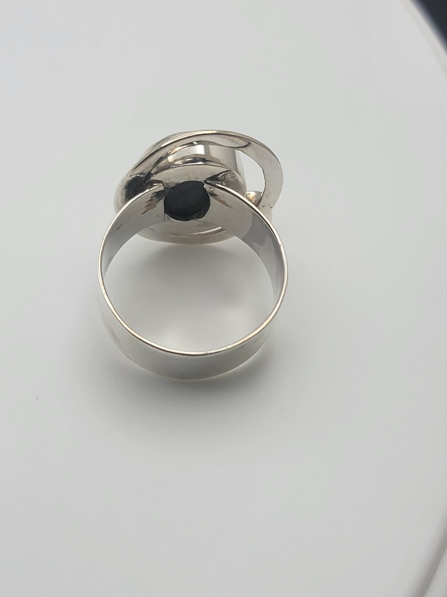 The underside view of the Labradorite Ring 925 Sterling Silver Statement Ring, demonstrating the intricate craftsmanship and the stunning labradorite stone. A stunning option for casual jewelry lovers, this ring serves as a perfect Gift for Her or Gift for Him, ideal as a statement ring in sterling silver.