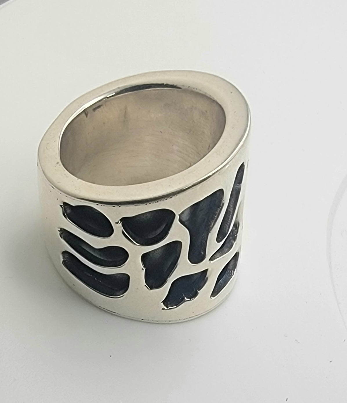 925 Sterling Silver Abstract Design Ring displayed on a white surface highlighting its contemporary abstract shapes.