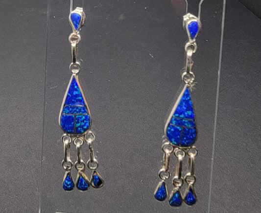 Handcrafted opal inlay dangle earrings showcasing stunning blue opal in a teardrop design.