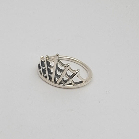 Sterling silver size 7 ring with open fan-shaped lattice design and oxidized detailing, 1.5 mm band.